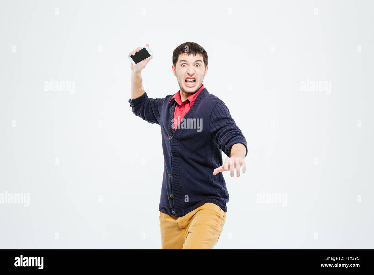 angry-man-throwing-phone-into-camera-isolated-on-a-white-background-FTX39G.jpg