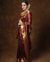 trisha-krishnan-look-stunningly-beautiful-in-maroon-and-gold-ethnic-zari-silk-blend-banarasi-s...jpg