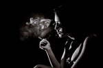 monochrome-portrait-young-girl-who-is-smoking-with-big-decollete-eyeglasses.jpg
