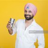 closeup-of-a-sikh-man-drinking-lassi-and-smiling-picture-id464743599.jpg