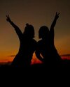 silhouette-of-girls-make-heart-with-their-hand-happy-friendship-concept-photo.jpg