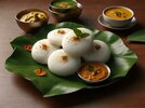 ai-generated-idli-with-sambar-coconut-chutney-and-kara-chutney-served-in-a-banana-leaf-photo.jpg