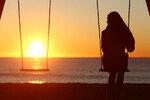 single-woman-alone-swinging-on-the-beach.jpg