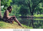 young-asian-woman-writing-on-260nw-1388208410.jpg