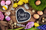 black-board-text-happy-easter-colorful-eggs-flowers-51216984.jpg