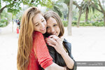 focused_179886940-stock-photo-two-female-friends-hugging-park.jpg