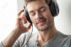 30867484-handsome-young-man-listening-to-music-guy-wearing-headphones-with-closed-eyes-on-grey...jpg