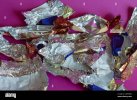 lots-of-crumpled-shiny-candy-wrappers-on-pink-background-empty-chocolate-candy-wrappers-leftov...jpg